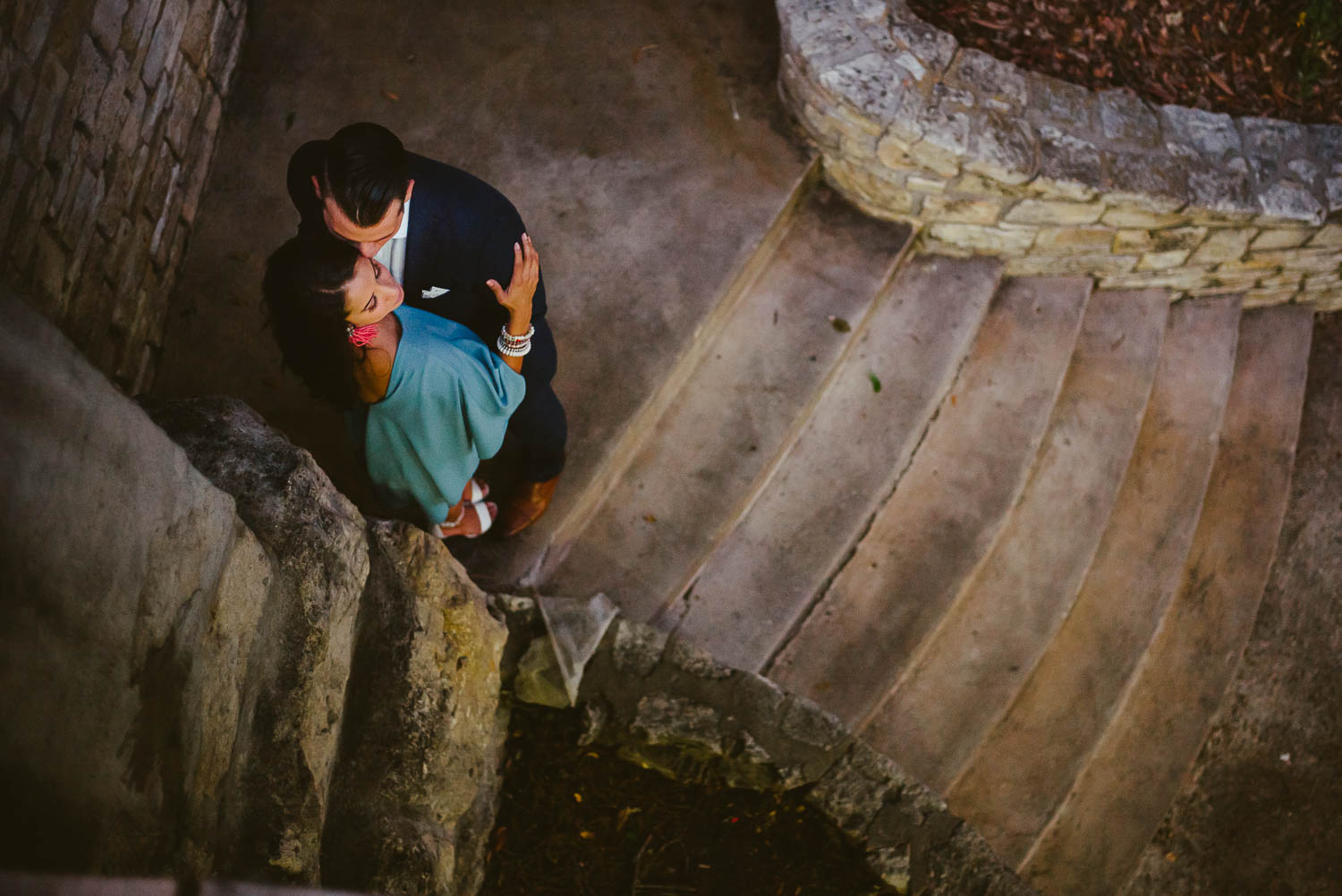 Couple in stairwell riverwalk Downtown San Antonio Engagement photos