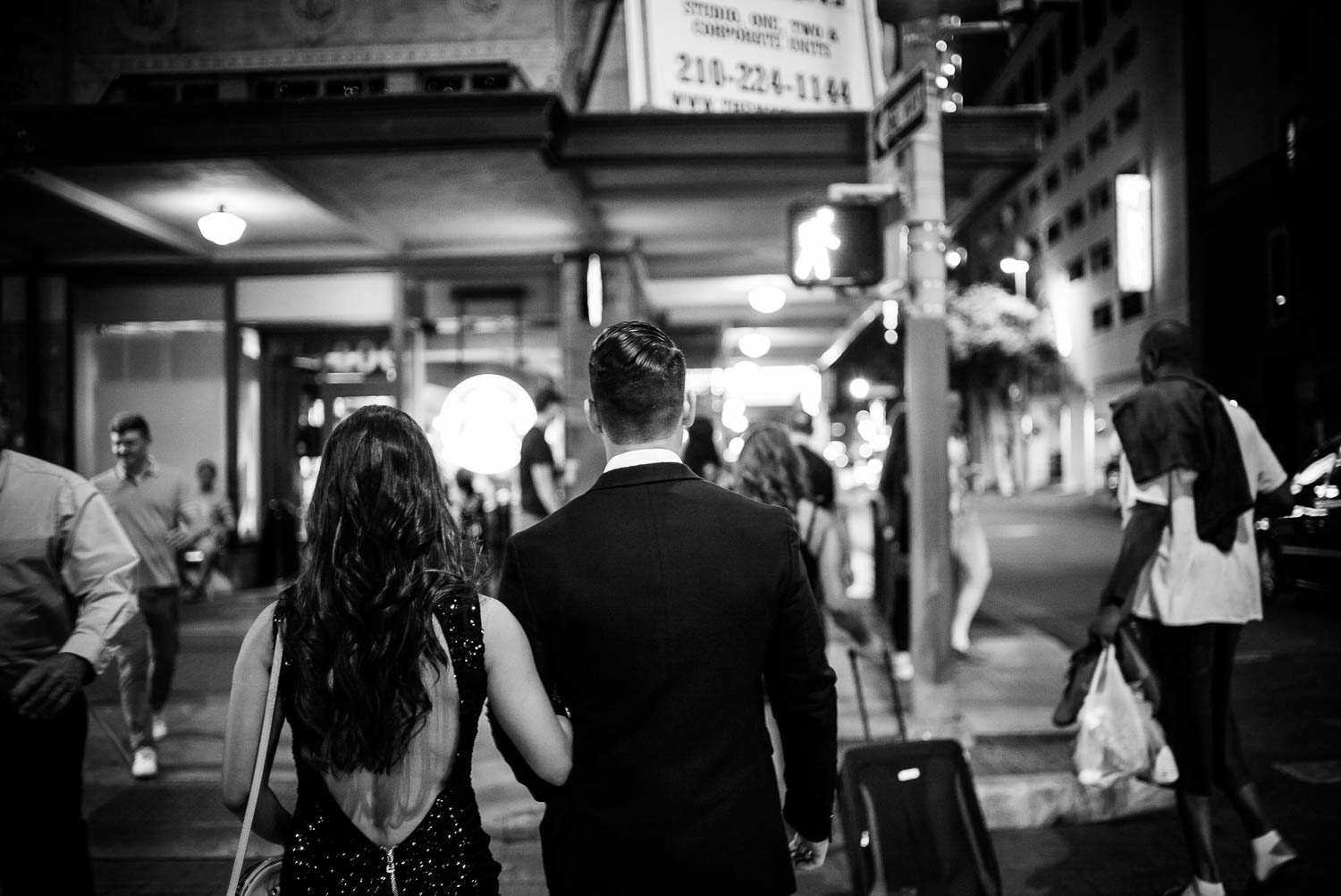 Couple at crosswalk Downtown San Antonio Engagement photos