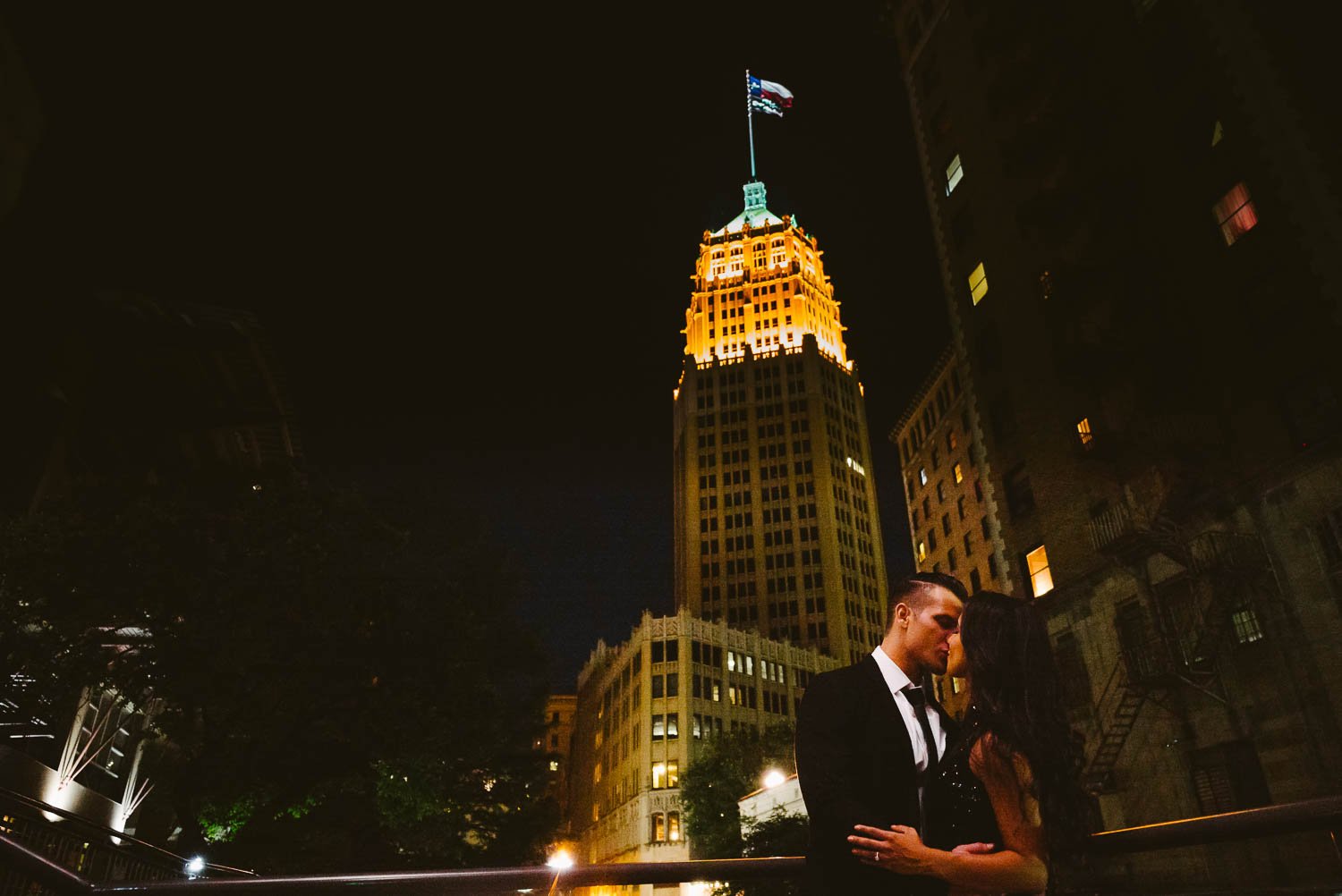 Lorenzo and Celina nighttime photo in front of the TowerLife Building a landmark and historic building in Downtown San Antonio, Texas, Downtown San Antonio Engagement photos