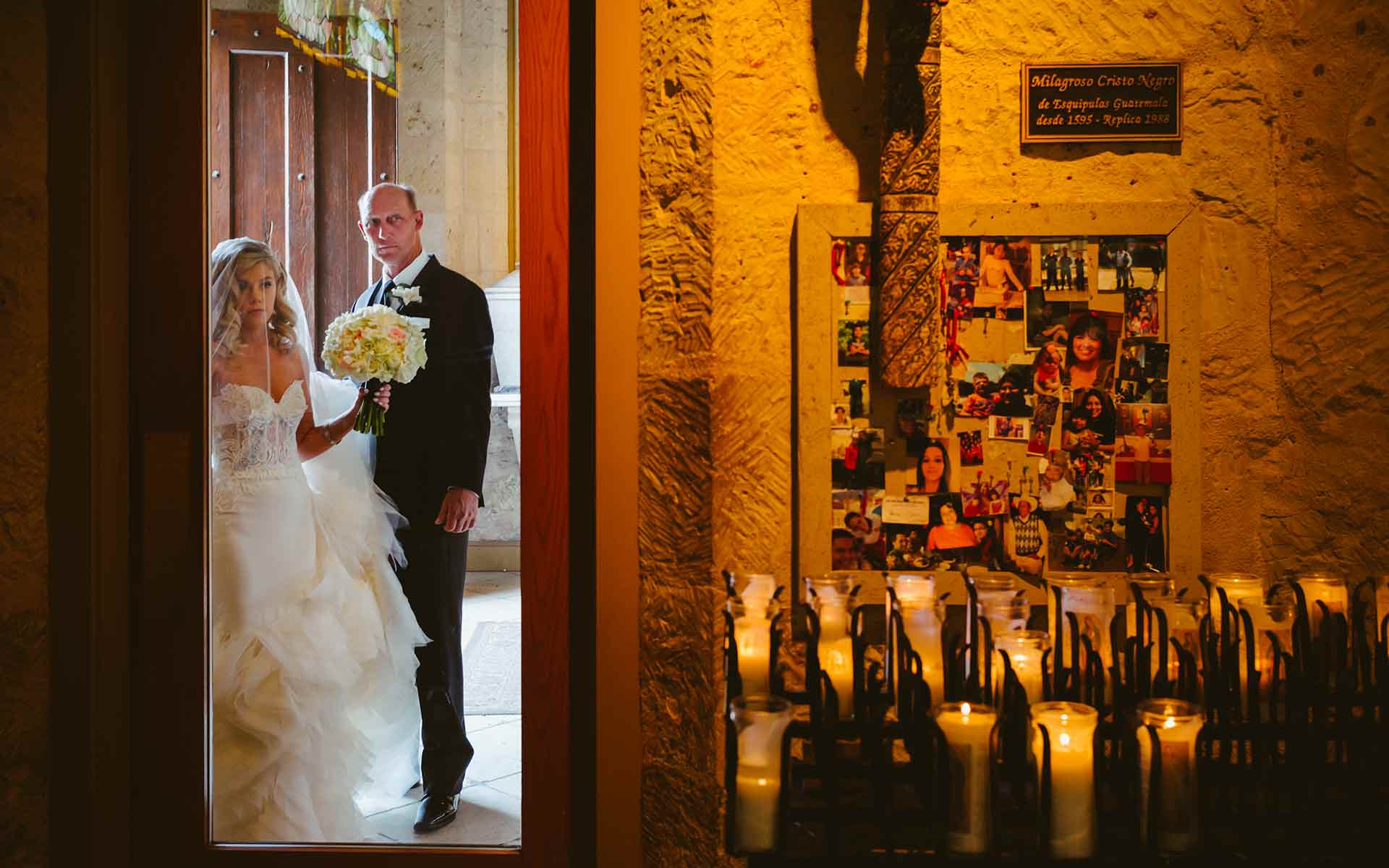 Bride and father await the signal to proceed to the start of the walk down the aisle at San Fernando Cathedral in San Antonio, Texas photographed with a Leica M by Philip Thomas
