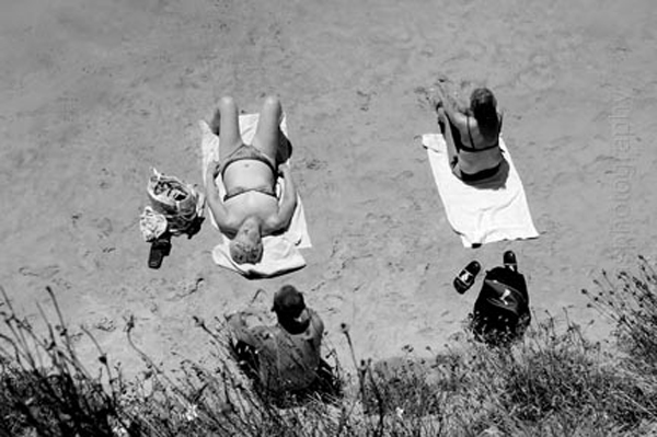 View looking down a sunbathers