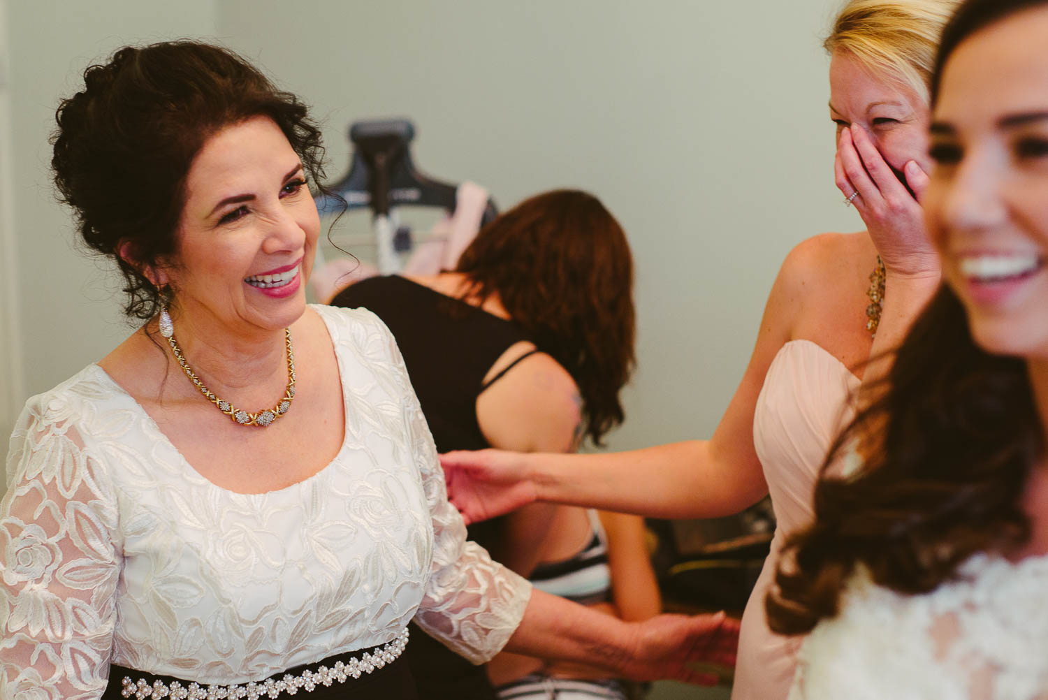 Mother and sister of the groom reacts to seeing the bride at Za Za gardens-Leica photographer-Philip Thomas Photography