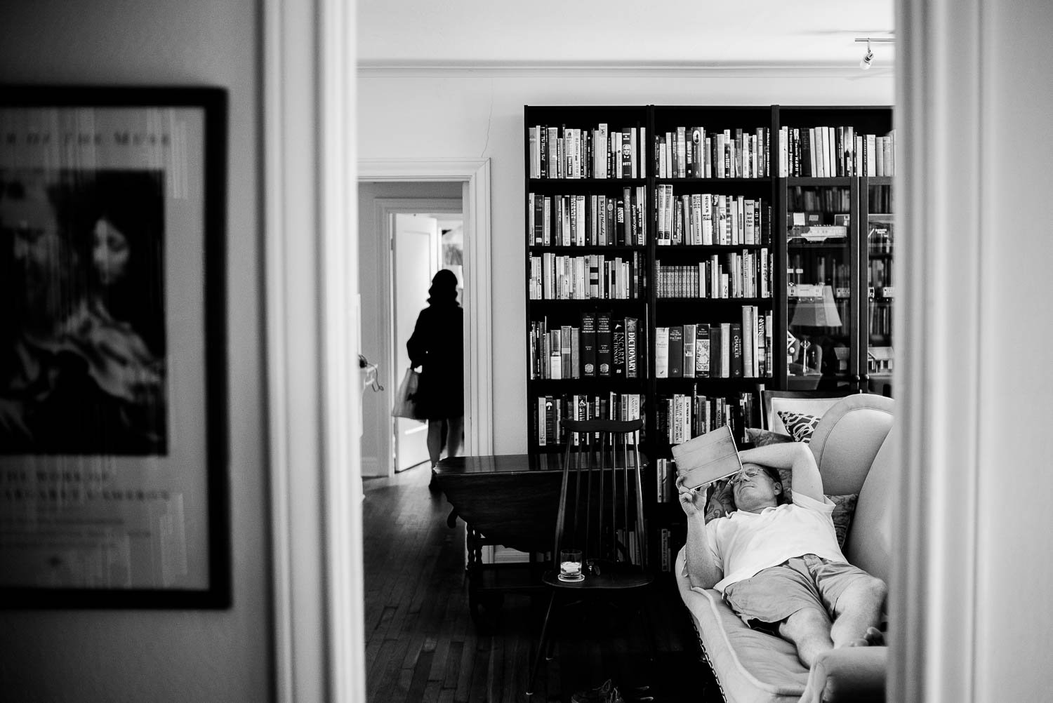 Bride's uncle relaxes on a couch during a busy wedding morning-Leica photographer-Philip Thomas Photography