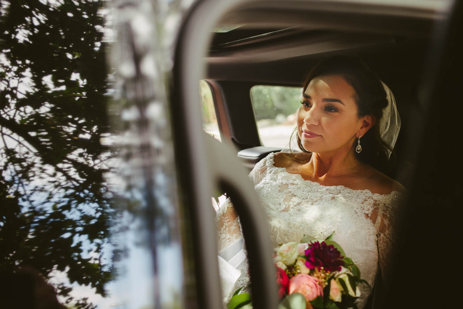 The bride sits in her car ready to be transported by her father to Mission Concepcion Wedding-Leica photographer-Philip Thomas Photography
