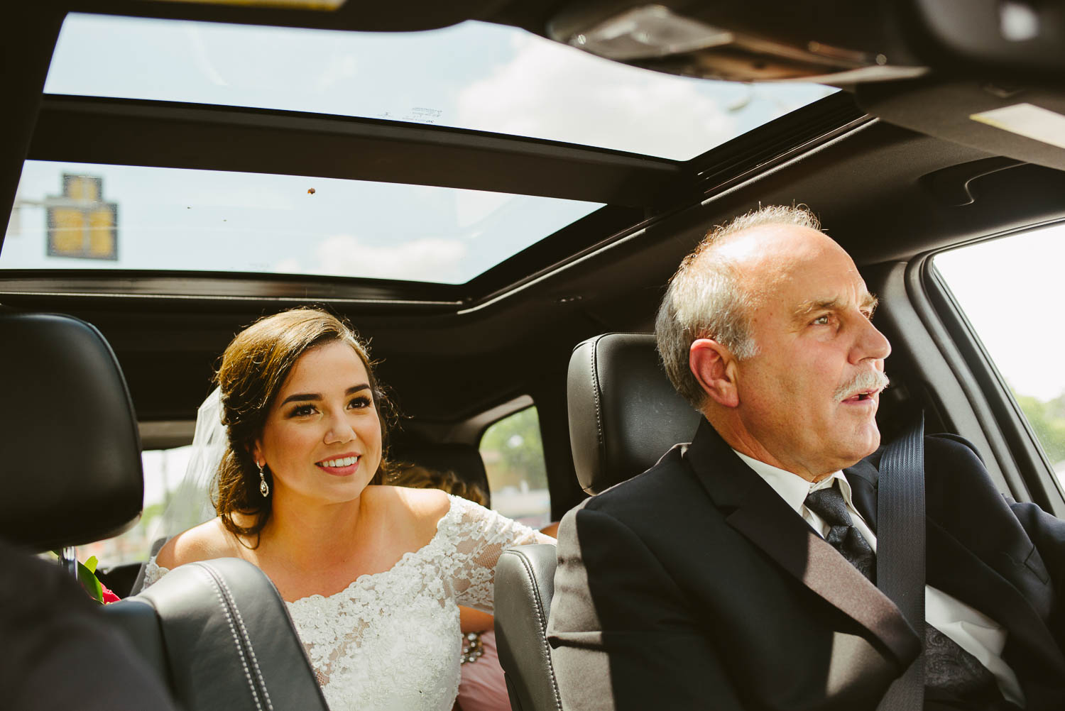 Father of the bride and daughter drive to the church from za za gardens to Mission Concepcion Wedding-Leica photographer-Philip Thomas Photography