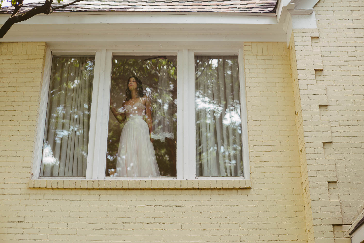 Houston Texas. Scene from her aunt's home as she stands in window-Leica photographer-Philip Thomas Photography