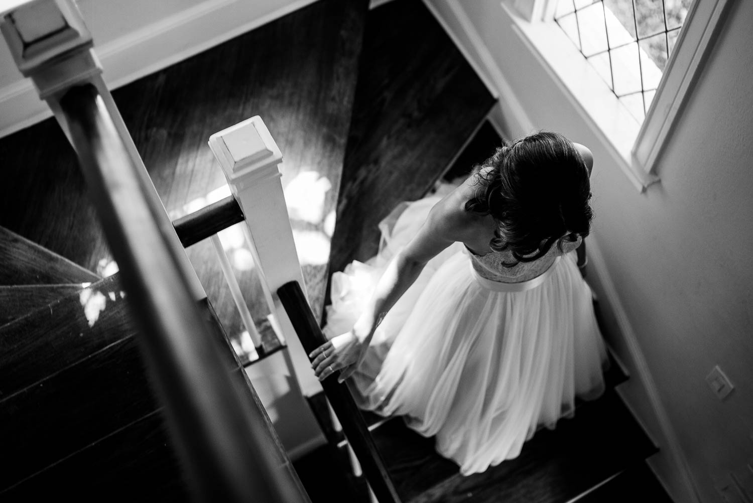 Jessica the bride descends her aunt's staircase-Leica photographer-Philip Thomas Photography