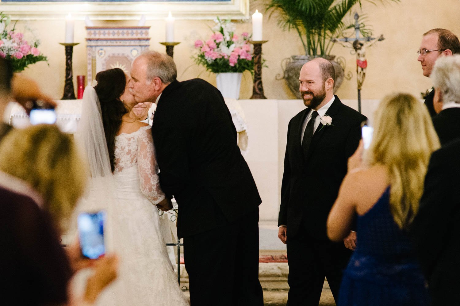 Father of the bride gives away his daughter to the groom at Mission Concepcion Wedding-Leica photographer-Philip Thomas Photography