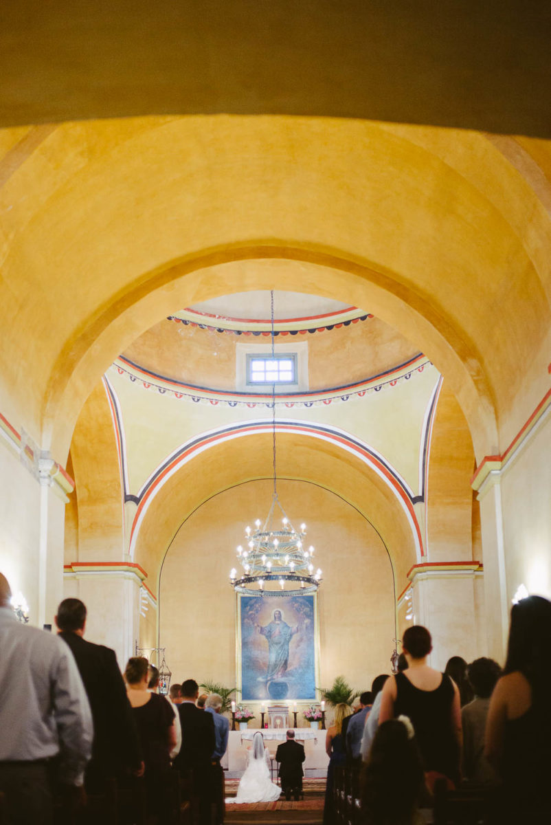 Couple kneeling for ceremony at Mission Concepcion Wedding-Leica photographer-Philip Thomas Photography