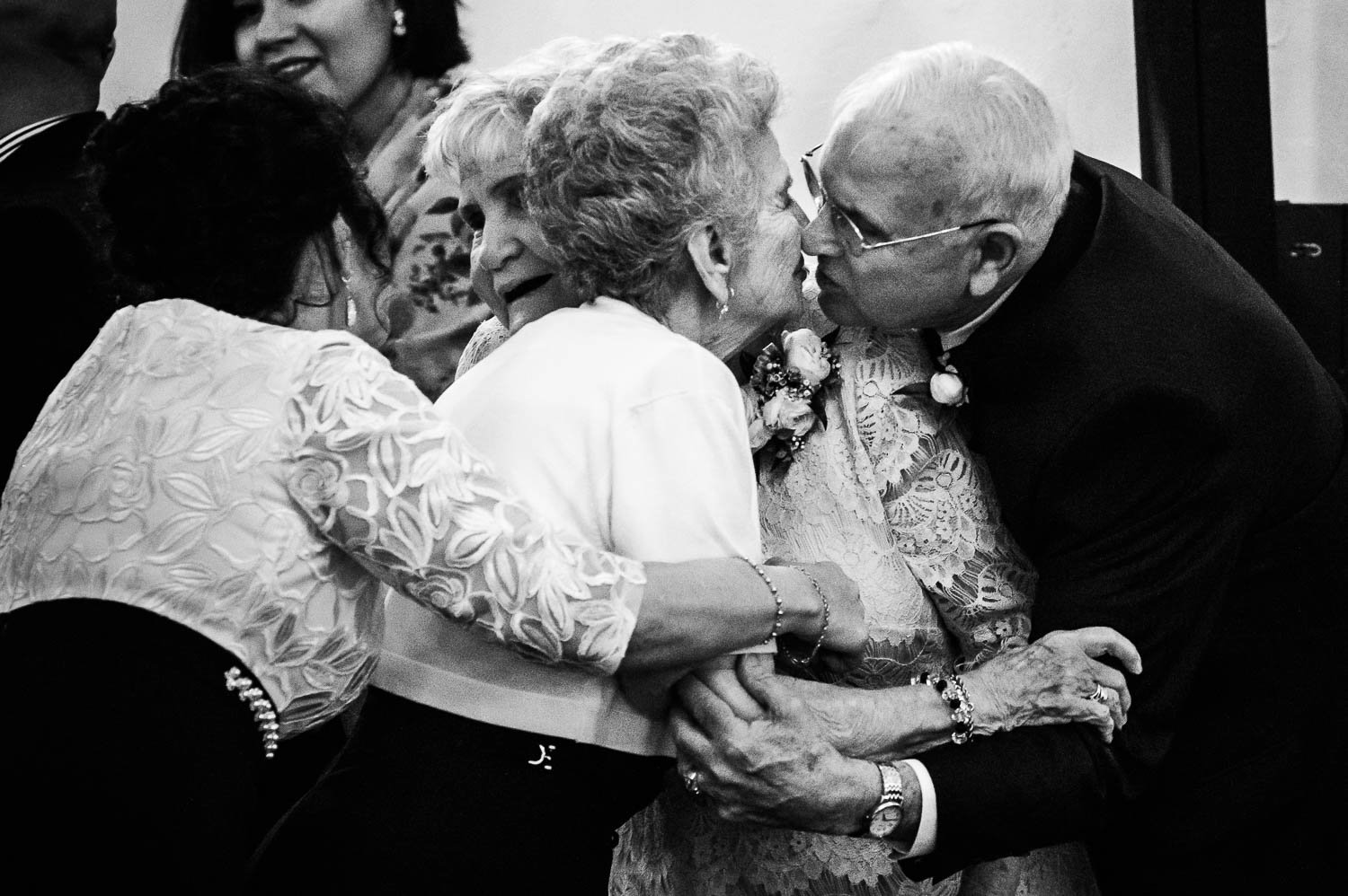 Hugs between family members of the bride at Mission Concepcion Wedding-Leica photographer-Philip Thomas Photography