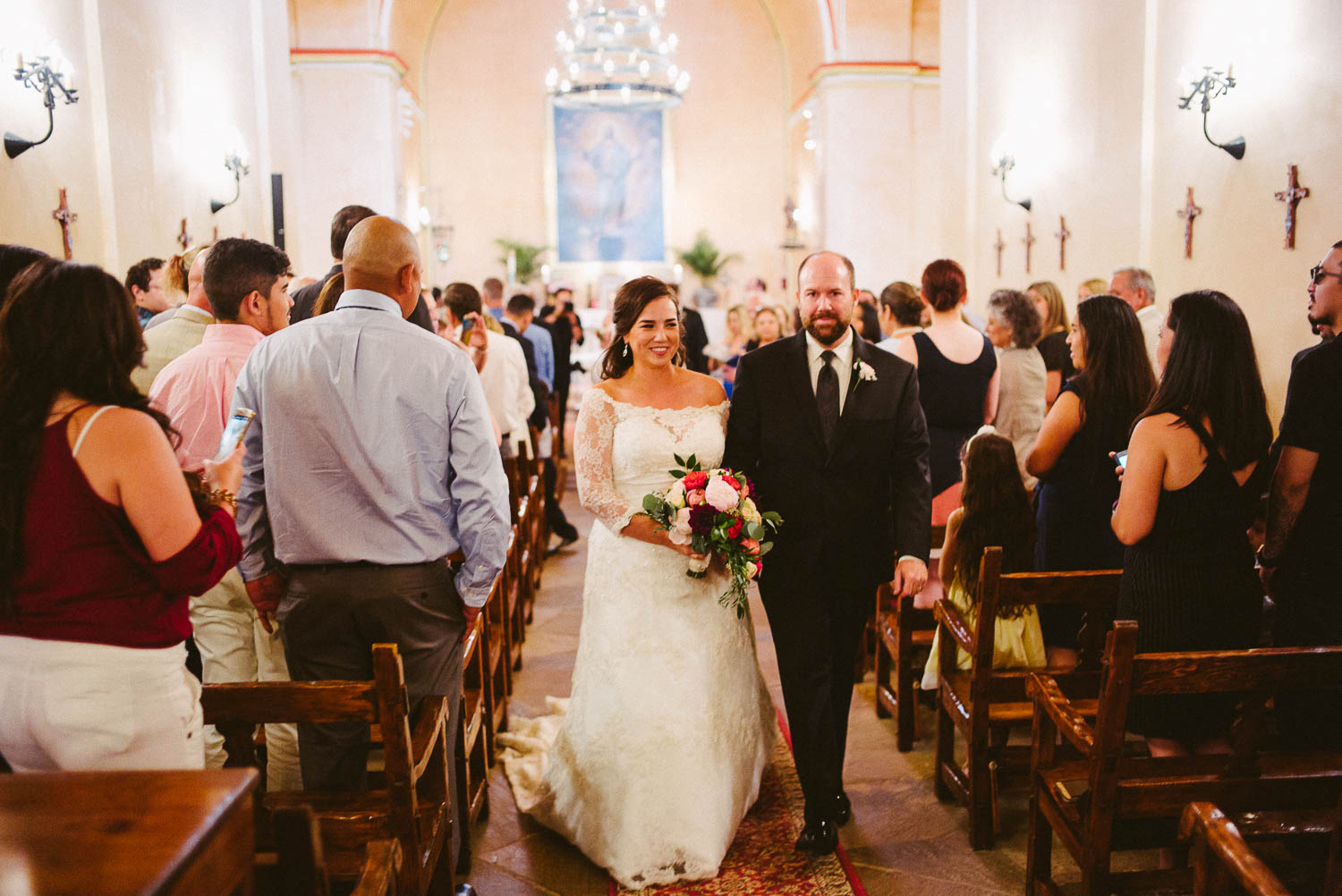 Just married couple Claire and Kevin walk down the aisle at Mission Concepcion Wedding-Leica photographer-Philip Thomas Photography