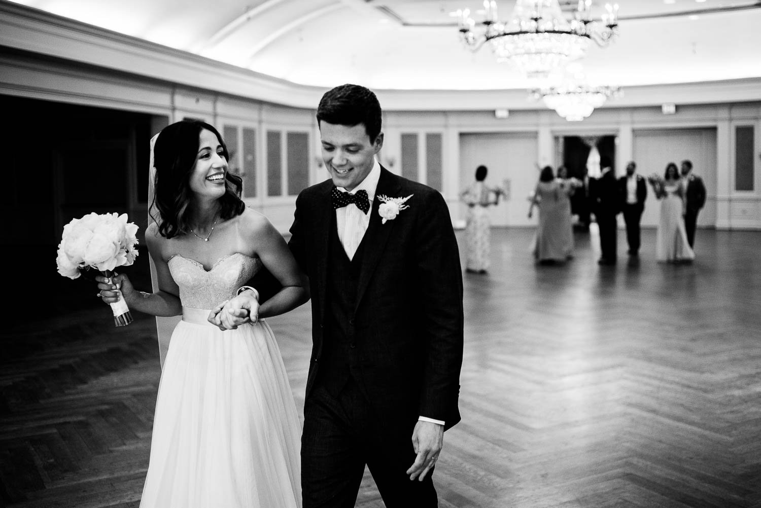 Just married couple delighted as they walk out of ceremony River Oaks Country Club-Leica photographer-Philip Thomas Photography