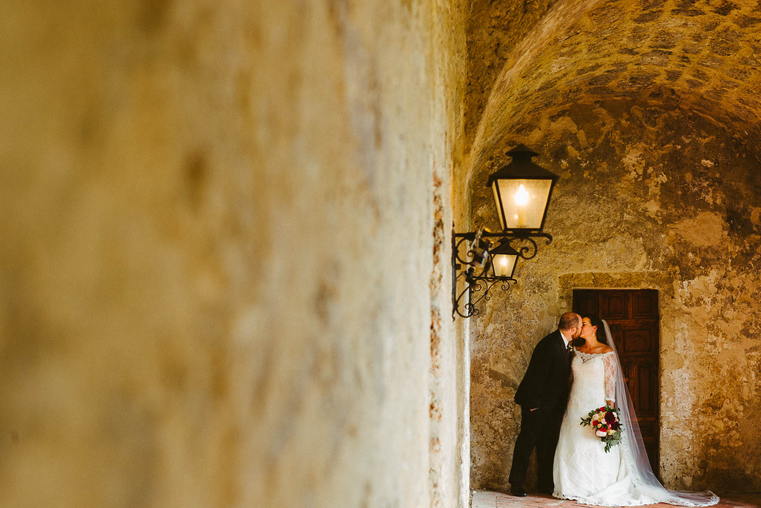 A posed kiss at Mission Concepcion Wedding-Leica photographer-Philip Thomas Photography