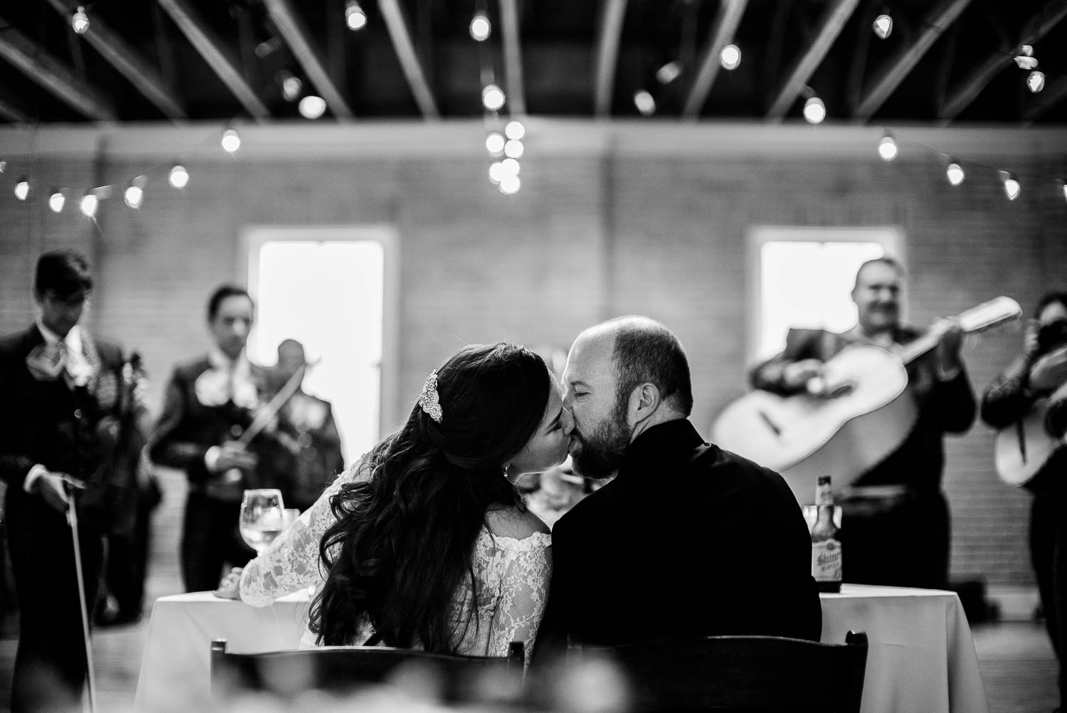 A kiss as the mariachi band plays at Za Za Gardens Wedding Reception-Leica photographer-Philip Thomas Photography