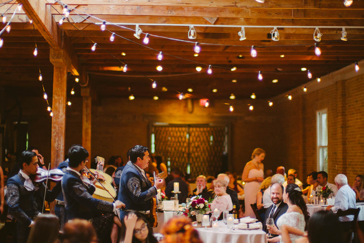 A mariachi band serenades the couple at Za Za Gardens Wedding Reception-Leica photographer-Philip Thomas Photography