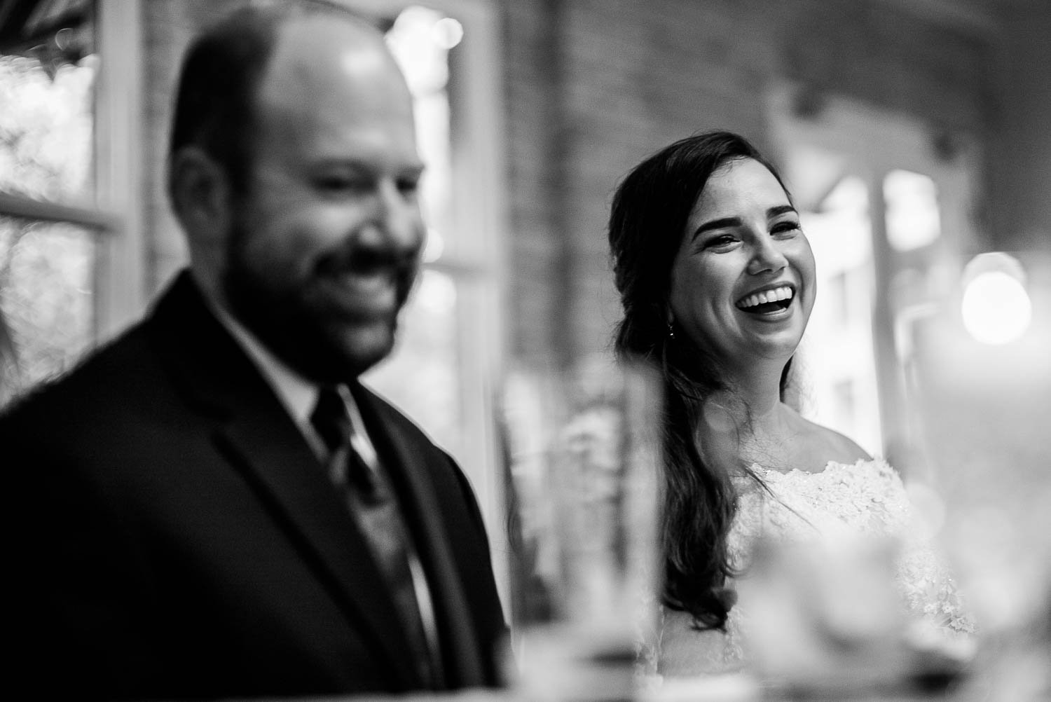 During the toasts, bride and groom react laughing Za Za Gardens Wedding Reception-Leica photographer-Philip Thomas Photography