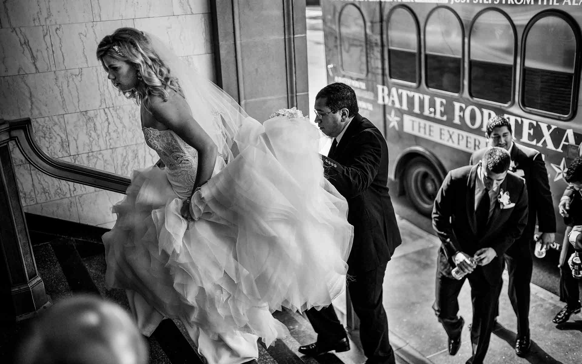 Bride arrives for wedding reception at St.Anthony historic hotel San Antonio Texas.jpg
