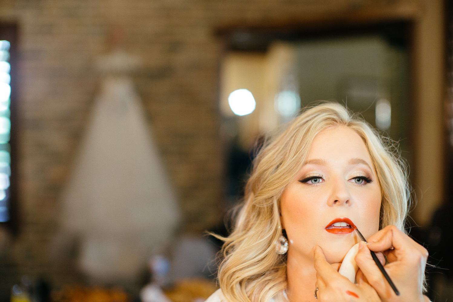 Kailey the bride has makeup applied at Chandelier of Gruene-03