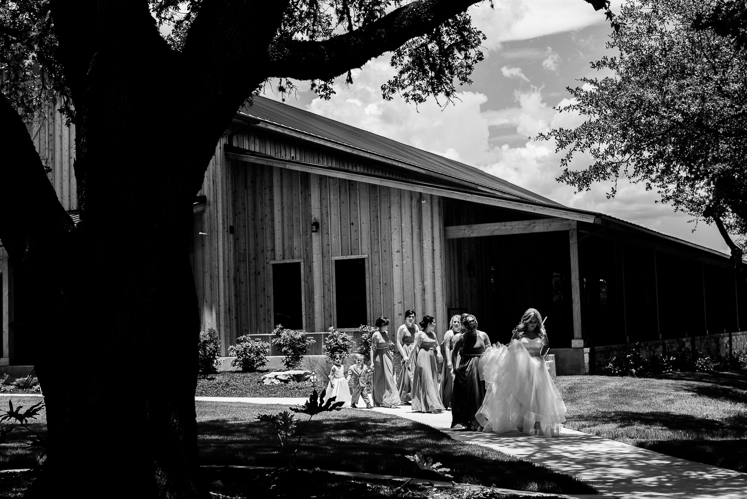 Bride and Bridesmaids walk to the reception Chandelier of Gruene-10