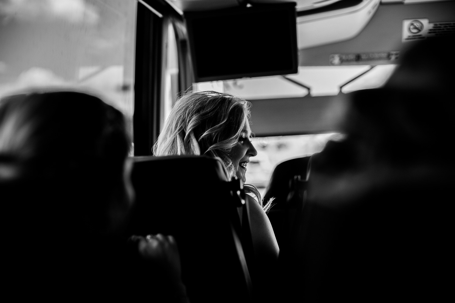 Bride on bus captured between Chandelier of Gruene-11