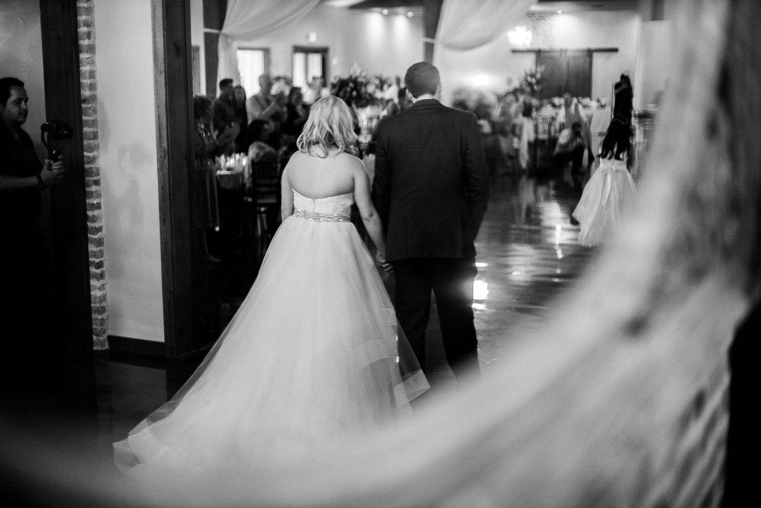 Bride and groom make their entrance at Chandelier of Gruene Wedding Reception-29