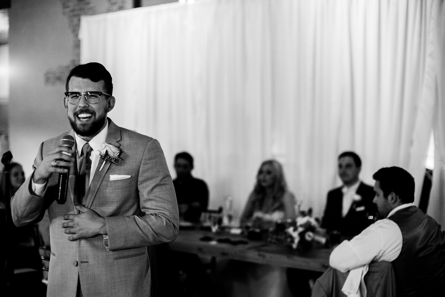 Best man tells stories during the toast Chandelier of Gruene Wedding Reception-34