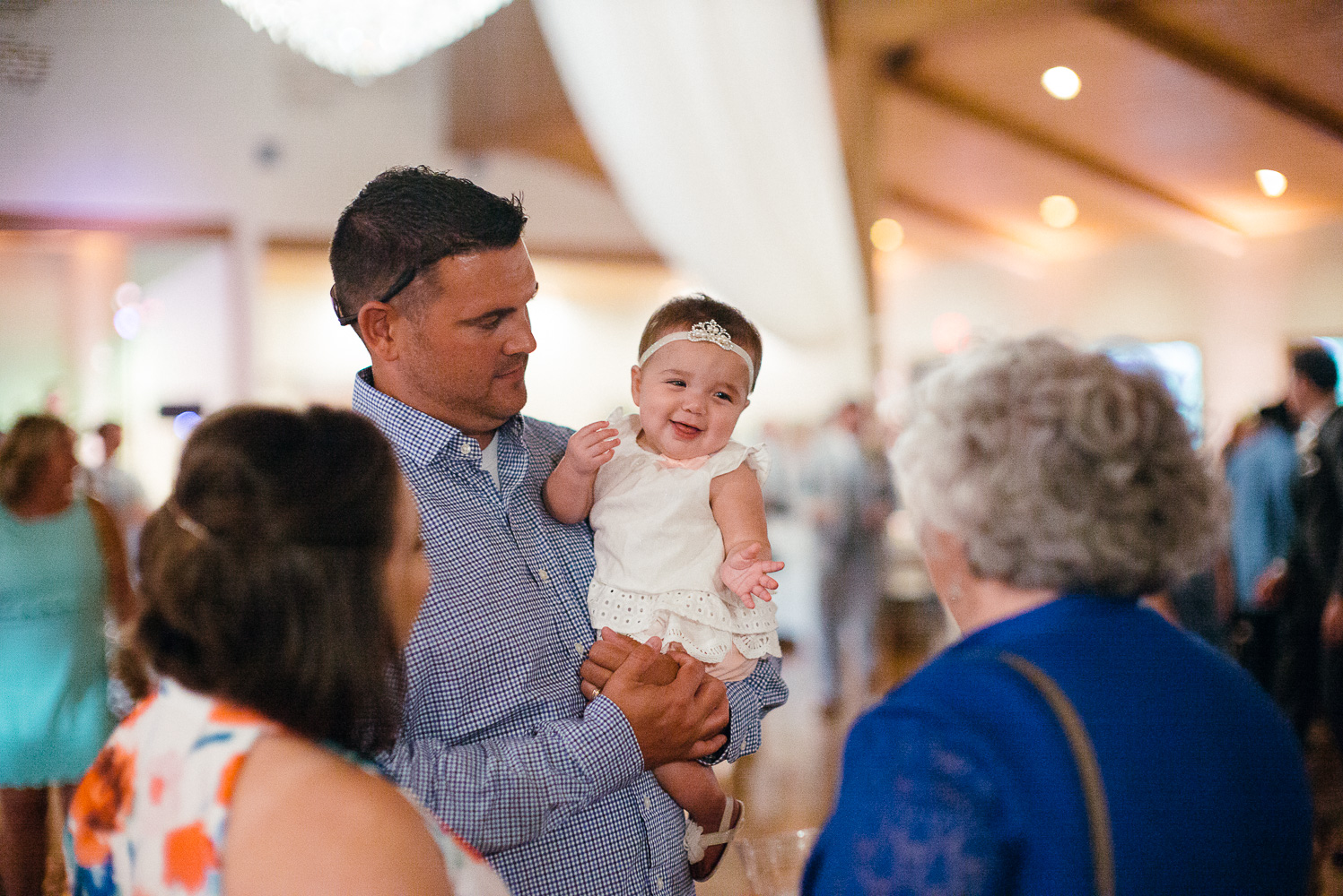 Cute baby with parents at Chandelier of Gruene Wedding Reception-40
