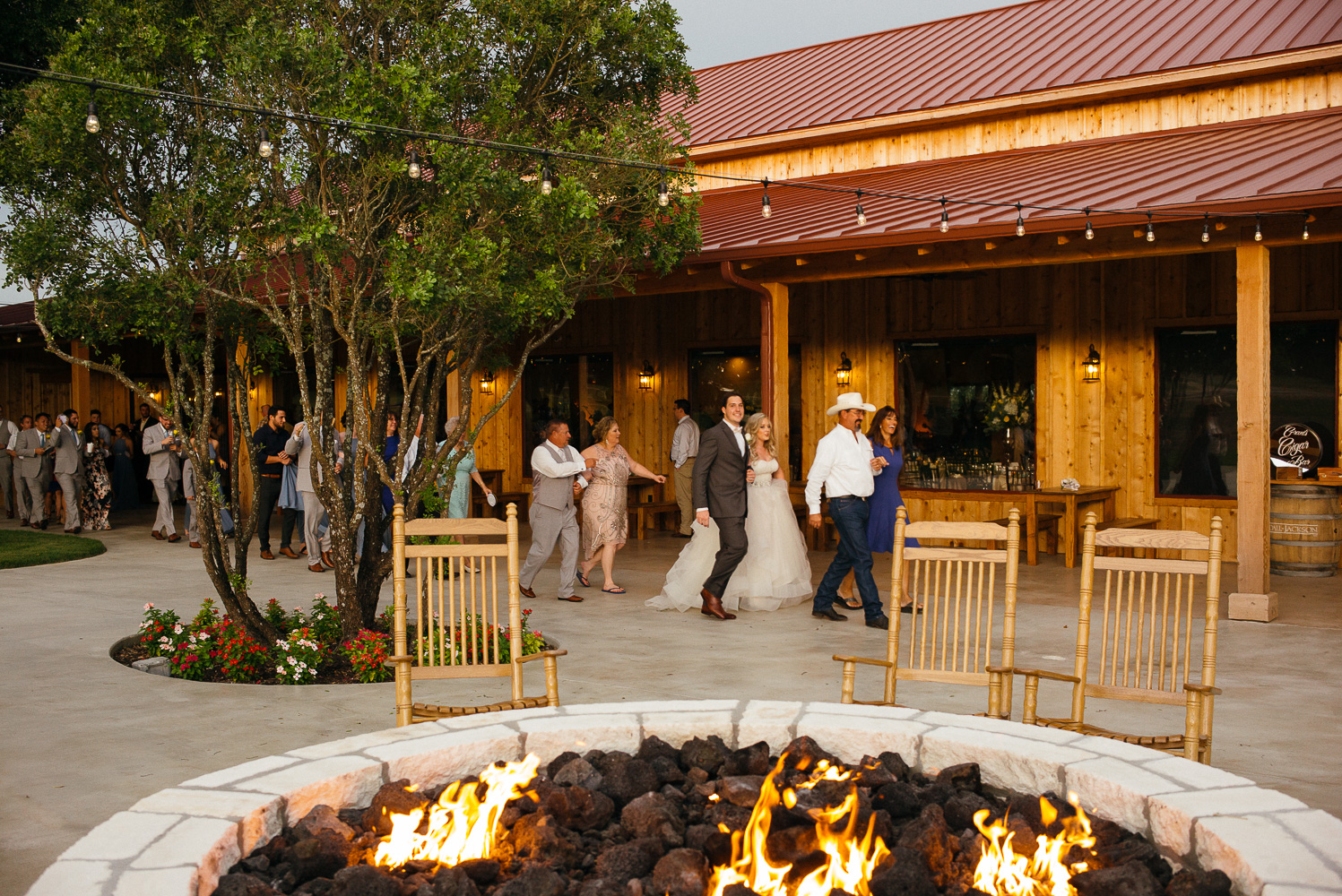 A Polish tradition The Grand March with a burning pit at Chandelier of Gruene Wedding Reception-41