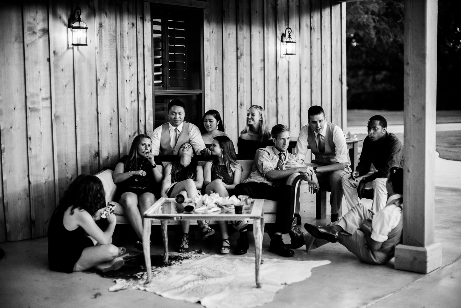 Young friends hang at Chandelier of Gruene Wedding Reception-51