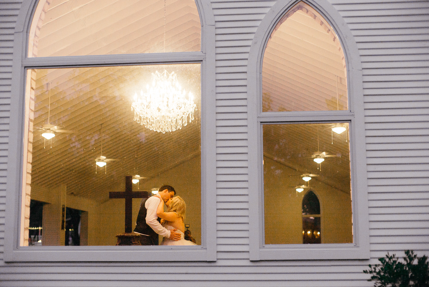 Kailey and Grant slow dance inside the church at Chandelier of Gruene Wedding Reception-54