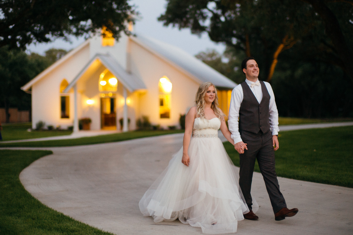 Couple walk after sunset at Chandelier of Gruene Wedding Reception-55