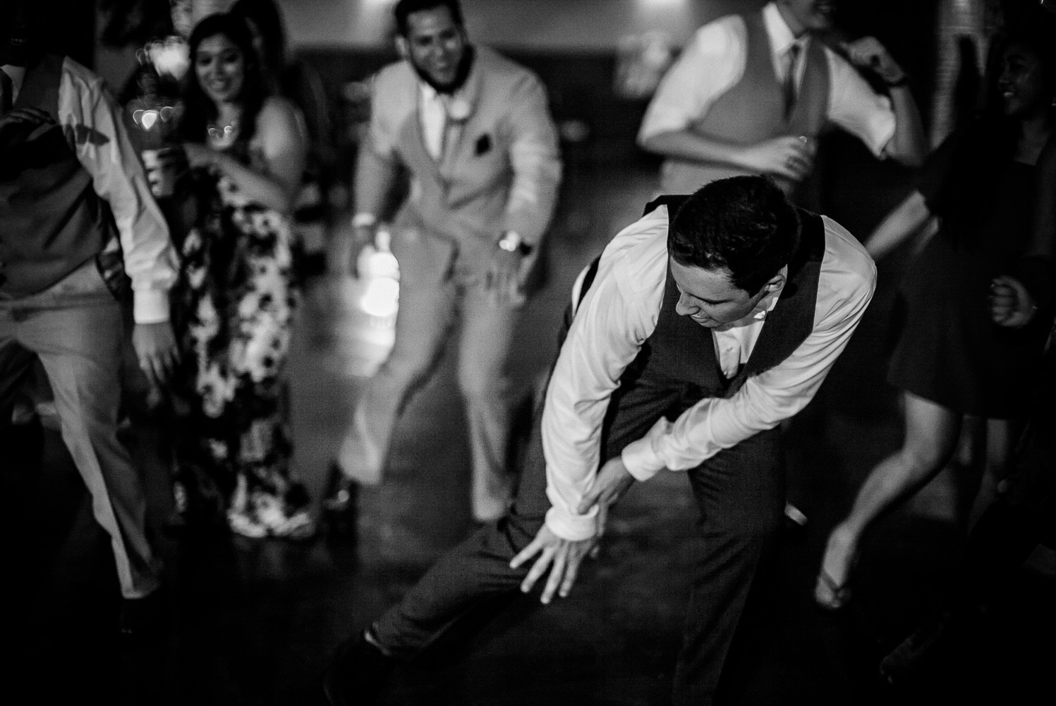 Groom dances at Chandelier of Gruene Wedding Reception-59