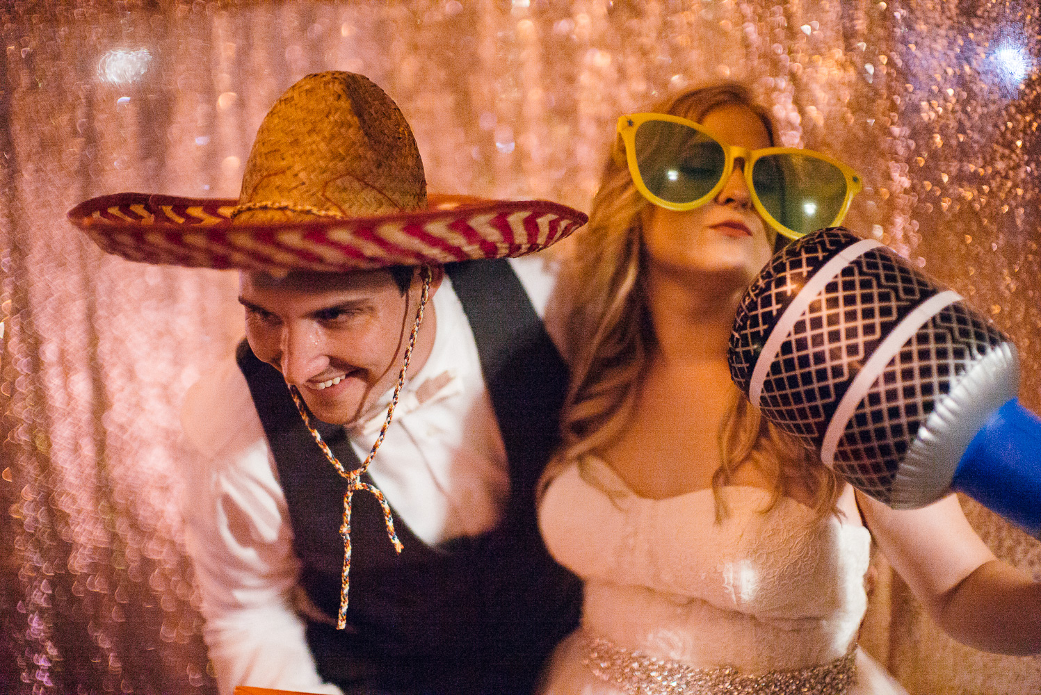 Couples antics at a photo booth Chandelier of Gruene Wedding Reception-63