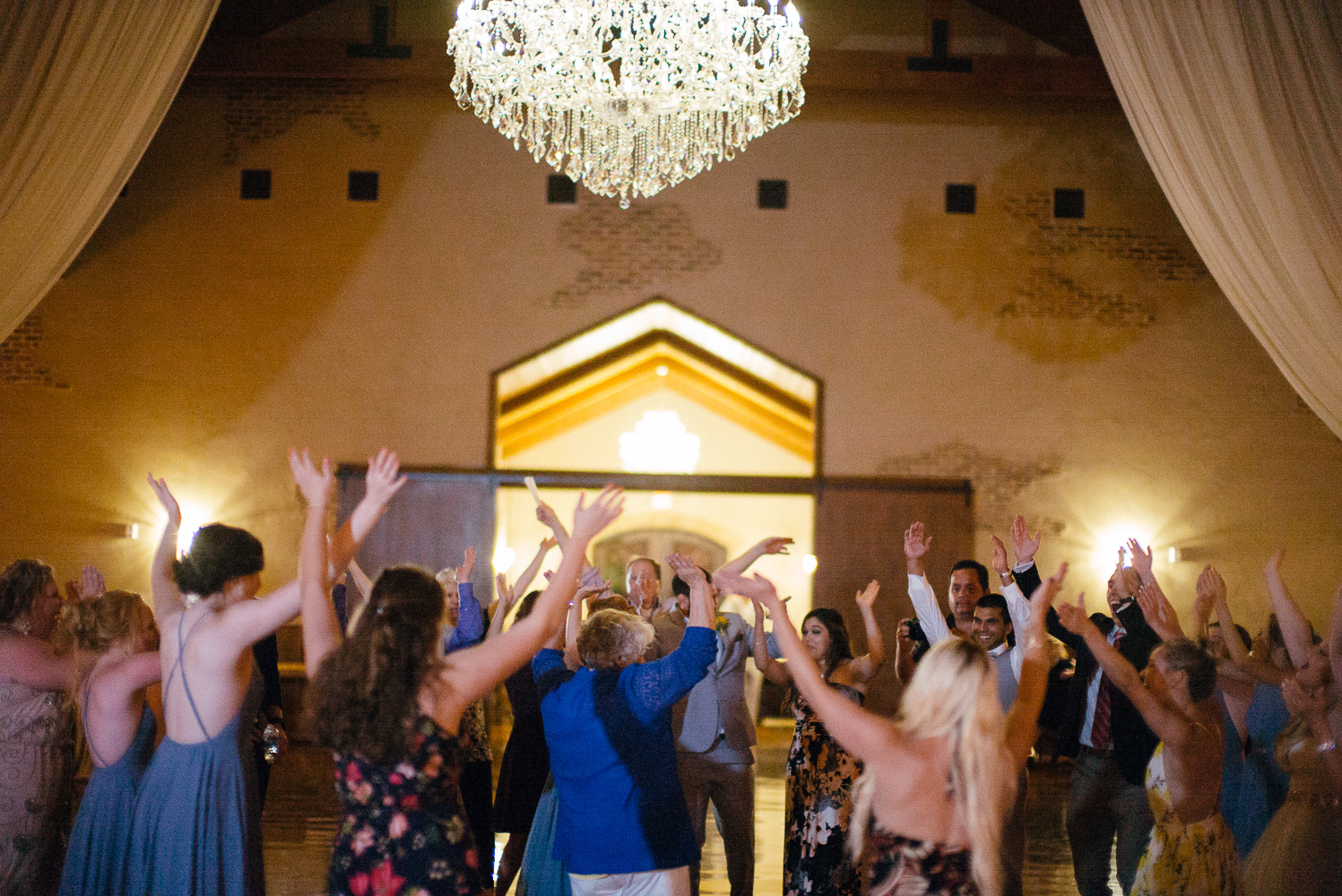 Reception guest dancing at Chandelier of Gruene Wedding Reception-65