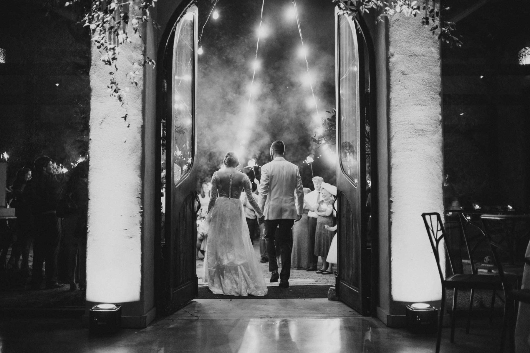 WPJA award winning images Couple-exit-wedding-reception-with-sparklers-at-Barr-Mansion-in-Austin-Texas-photographed-with-a-Leica-M10-and-35mm-summilux-by-Philip-Thomas