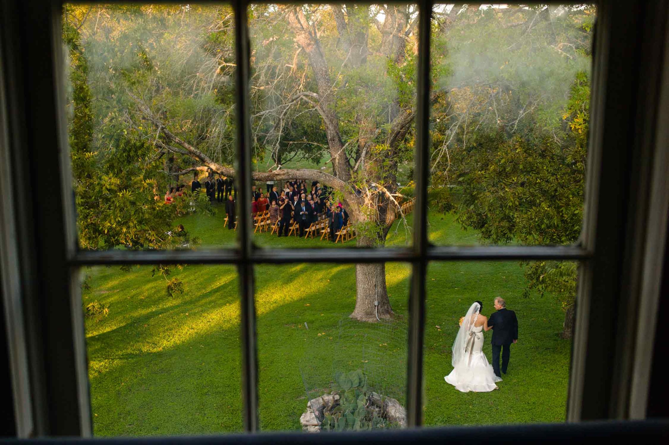 San Antonio Wedding Photographers - photographed at Don Strange Ranch, Texas as bride walks with her father - Leica M9