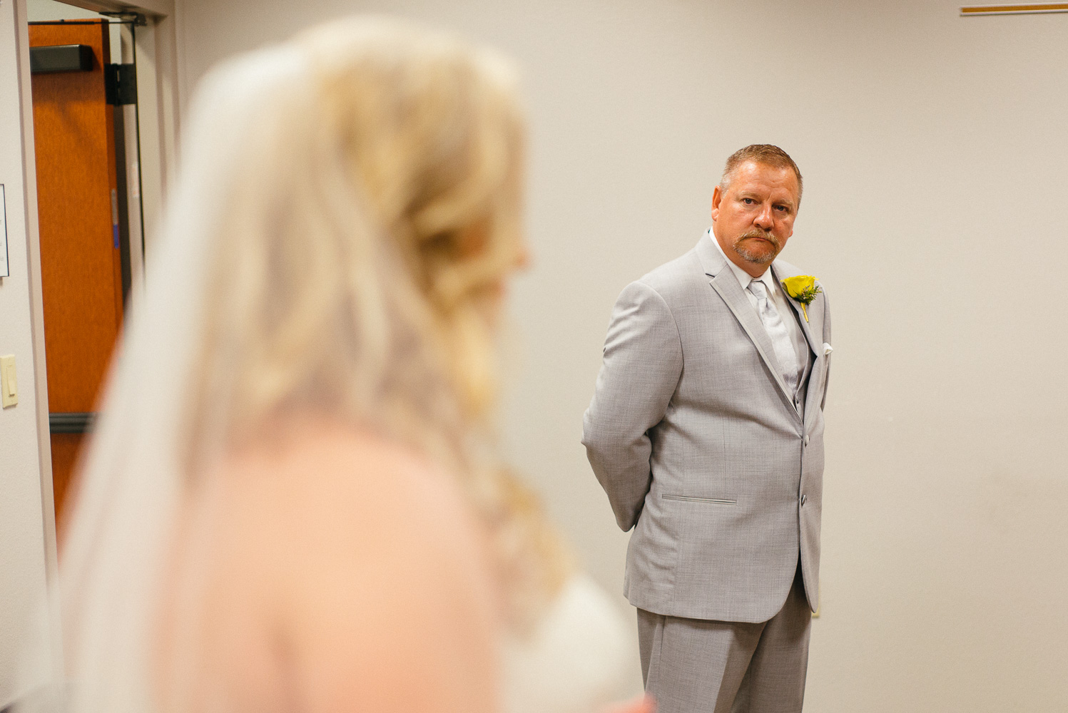 Father takes a quick emotional glance at his daughter Our Lady of Perpetual Help Wedding-14