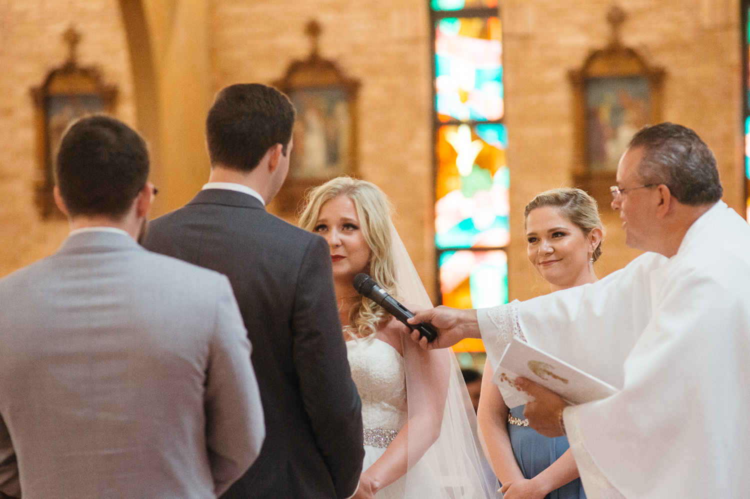 Brides becomes emotional during vows Our Lady of Perpetual Help Wedding-19