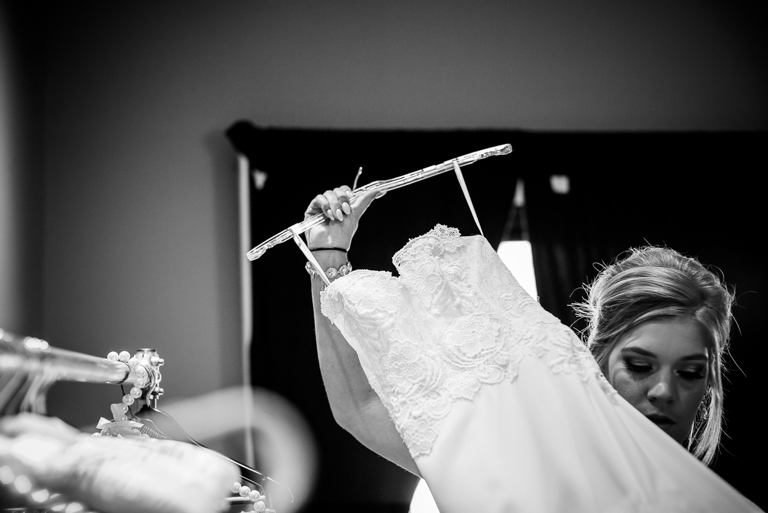 Brides dress is held high by her sister at St Anthony Hotel Wedding-09