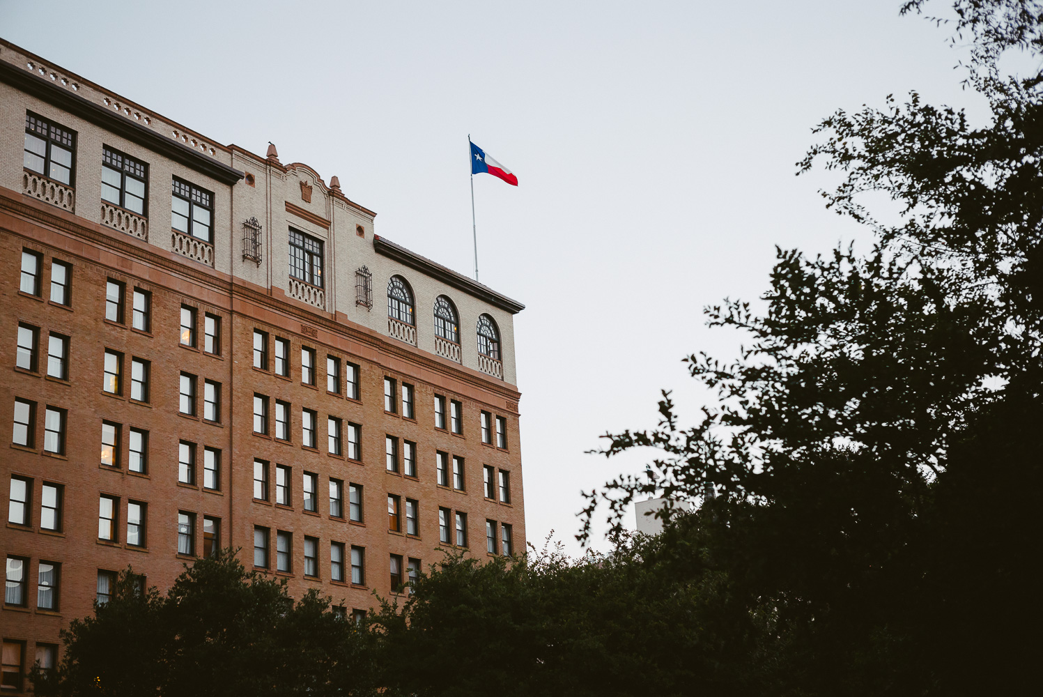 Around dusk shows the historic 1909 St. Anthony Hotel San Antonio Wedding Reception-39