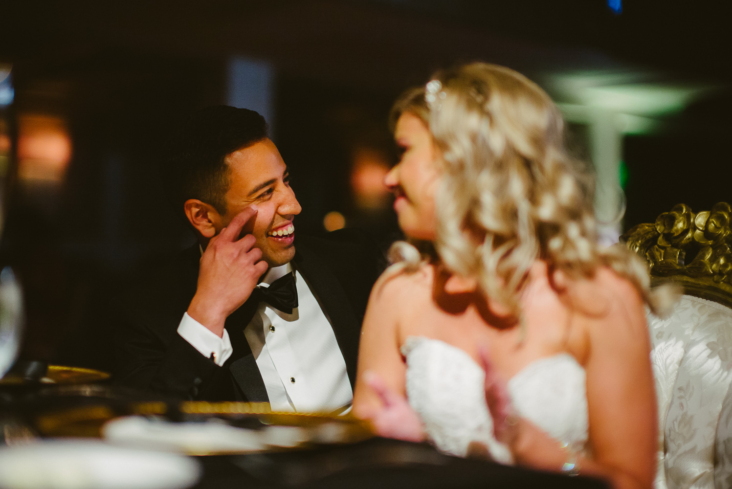 Nathan the groom reacts to a joke made by his father in law during a toast at St. Anthony Hotel San Antonio Wedding Reception-41