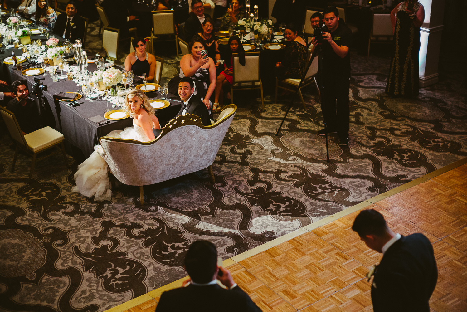 High angle looking down during speeches given by grooms best men at St. Anthony Hotel San Antonio Wedding Reception-43