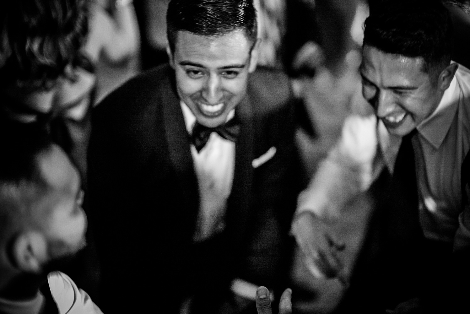 The groom Nathan dances jubilantly with friends at St. Anthony Hotel San Antonio Wedding Reception-55