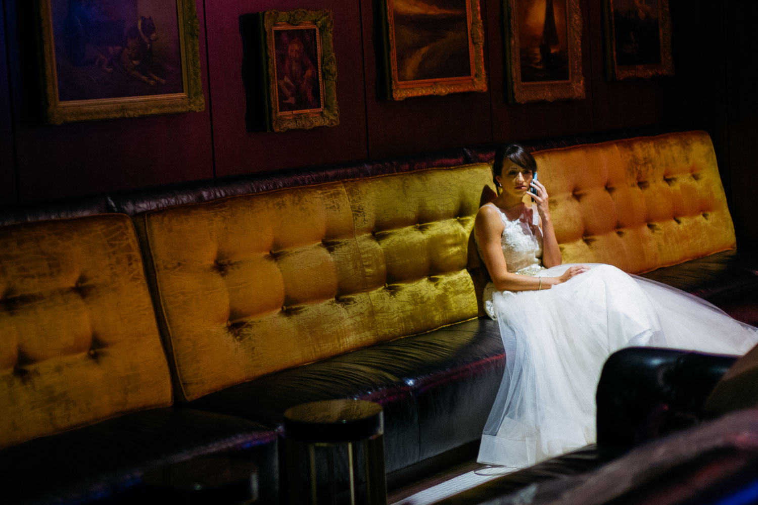 Bride on phone in a bar Wedding St Anthony Reception-Philip Thomas