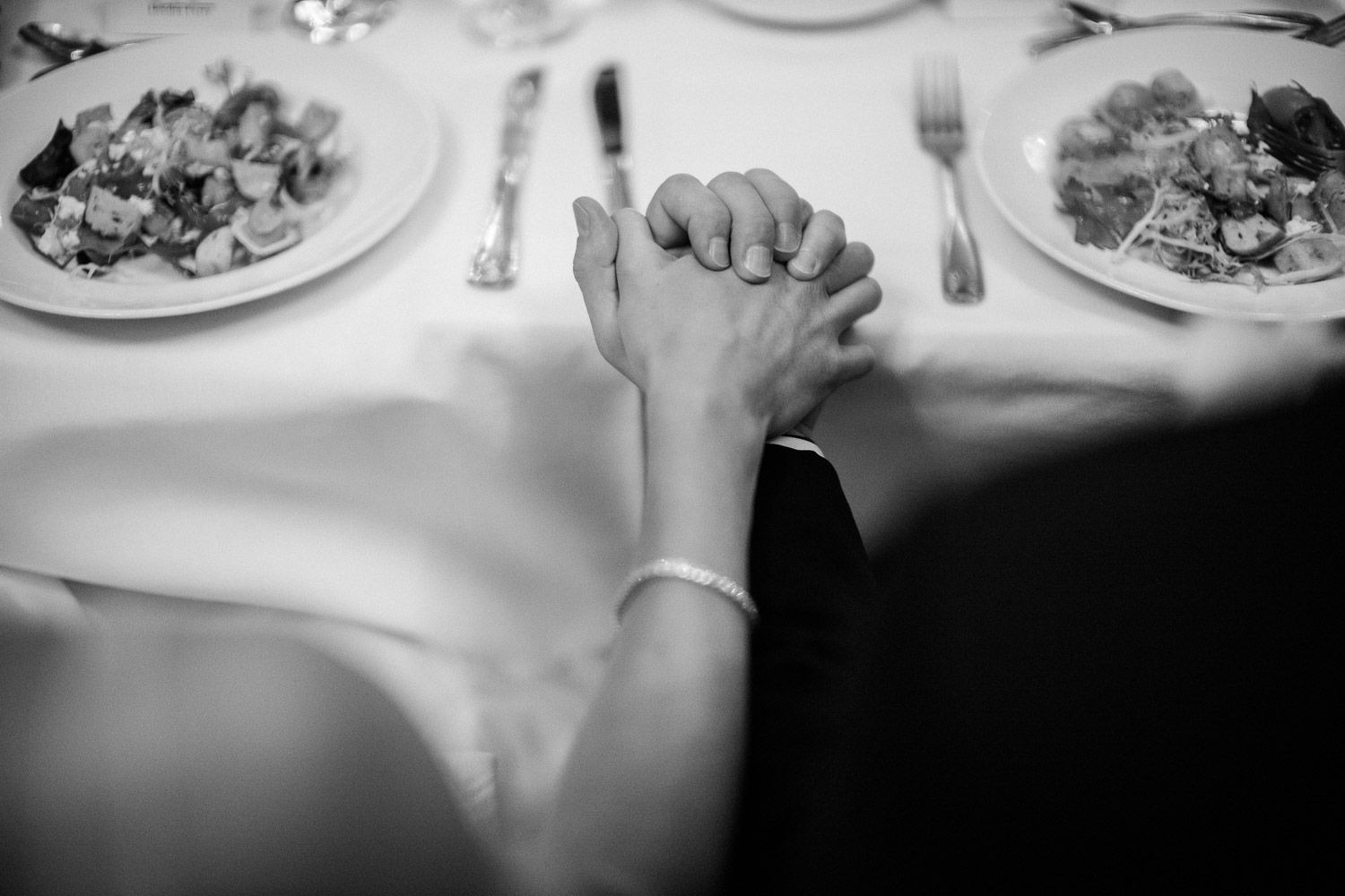 Deedra and Aaron holds hands during prayers at St Anthony Reception-Philip Thomas