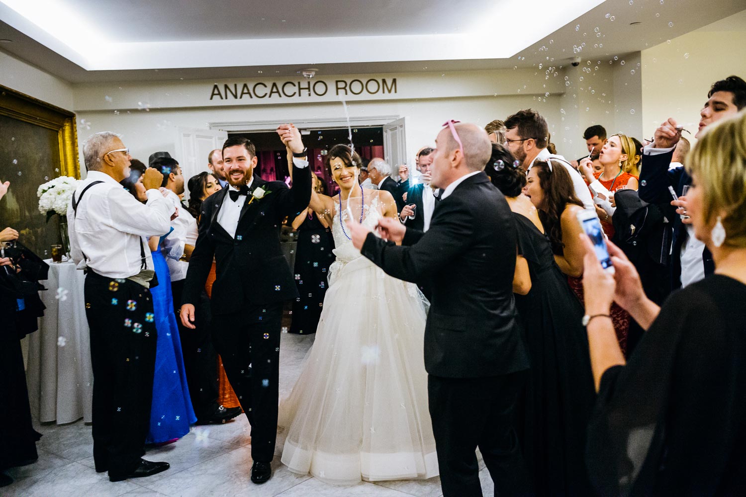 Delighted couple depart with bubbles at St.Anthony - Mission Concepcion Wedding St Anthony Reception-Philip Thomas