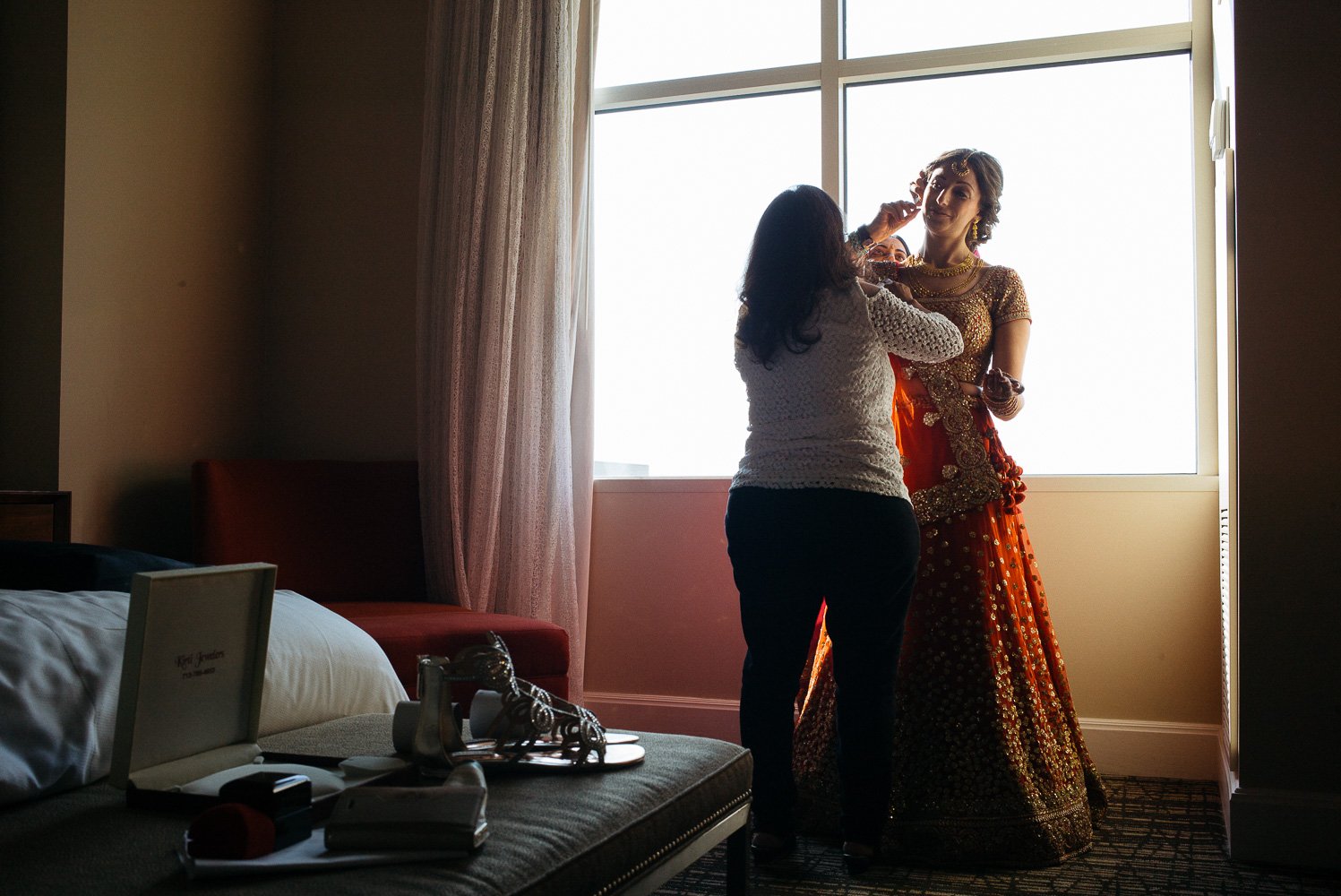 Final touches for bride in hotel room Hindu Jewish fusion wedding Sugar Land Marriott Hotel Texas-021