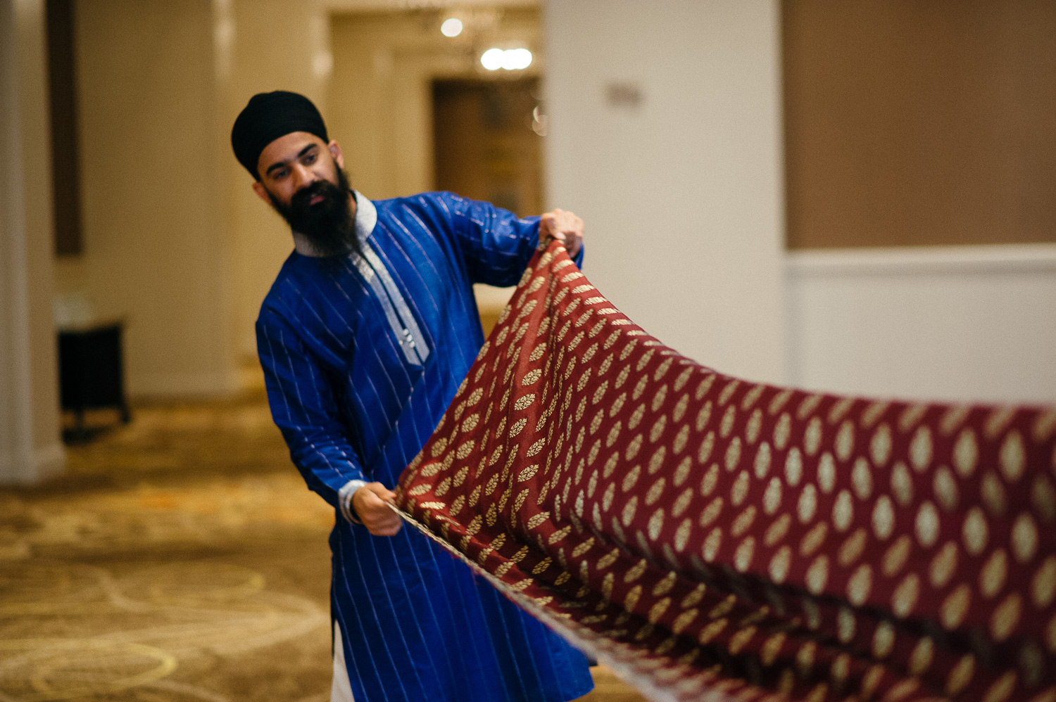 The safa or in this case a long piece of fabric is prepared for the groom Hindu Jewish fusion wedding Sugar Land Marriott Hotel Texas-026