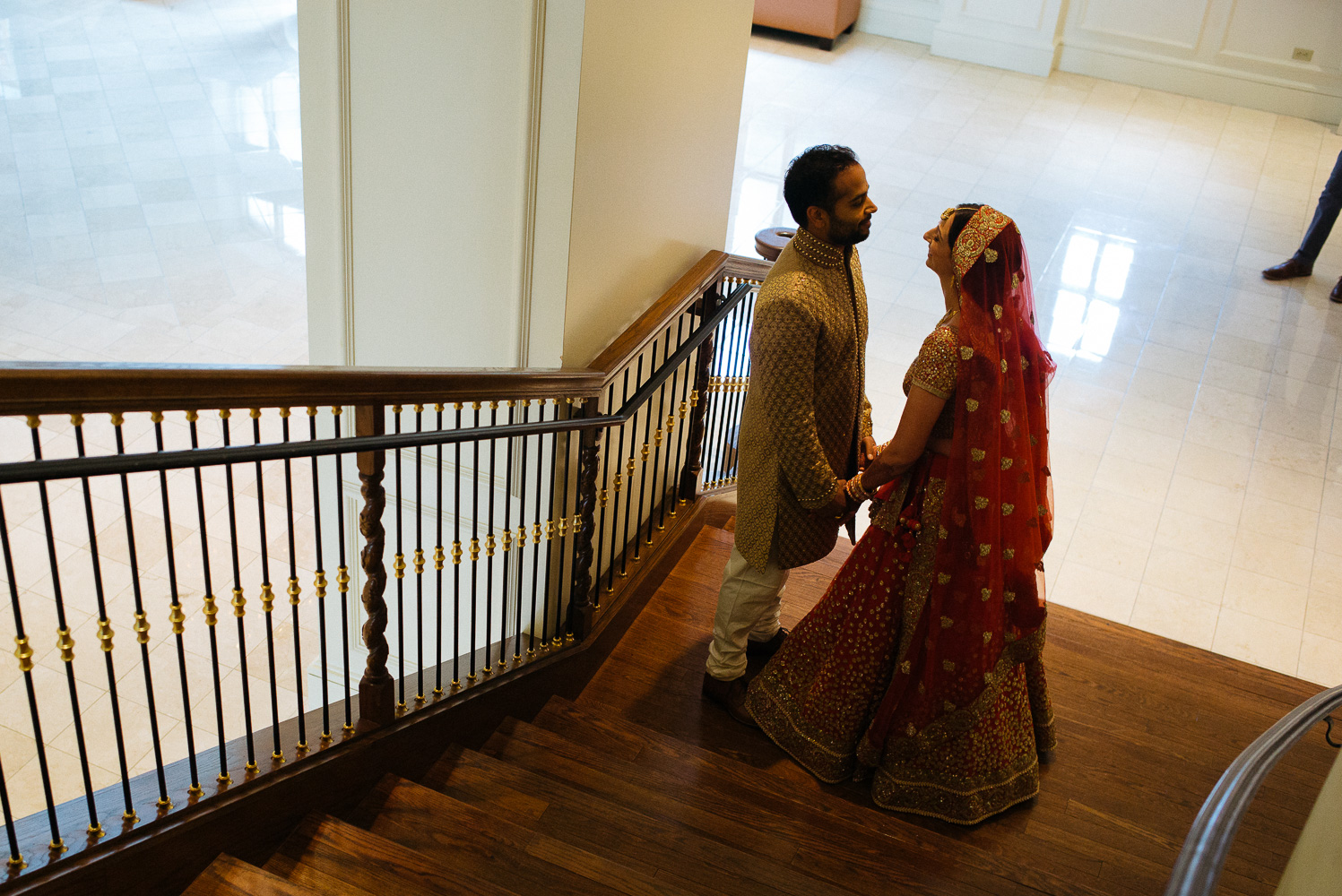 The safa or in this case a long piece of fabric is prepared for the groom Hindu Jewish fusion wedding Sugar Land Marriott Hotel Texas-026