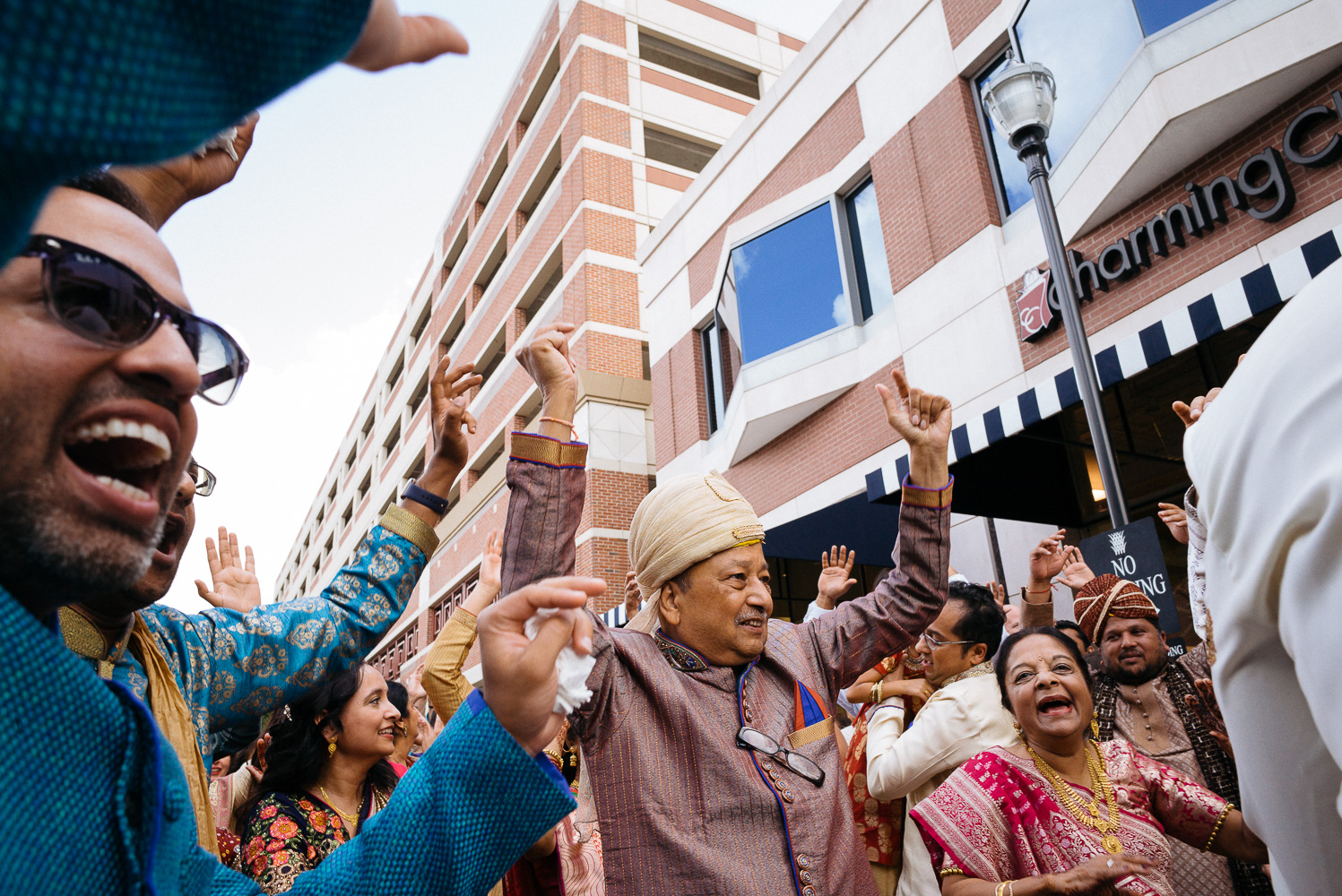 Father of the groom celebrates during baraat Hindu Jewish fusion wedding Sugar Land Marriott Hotel Texas-035